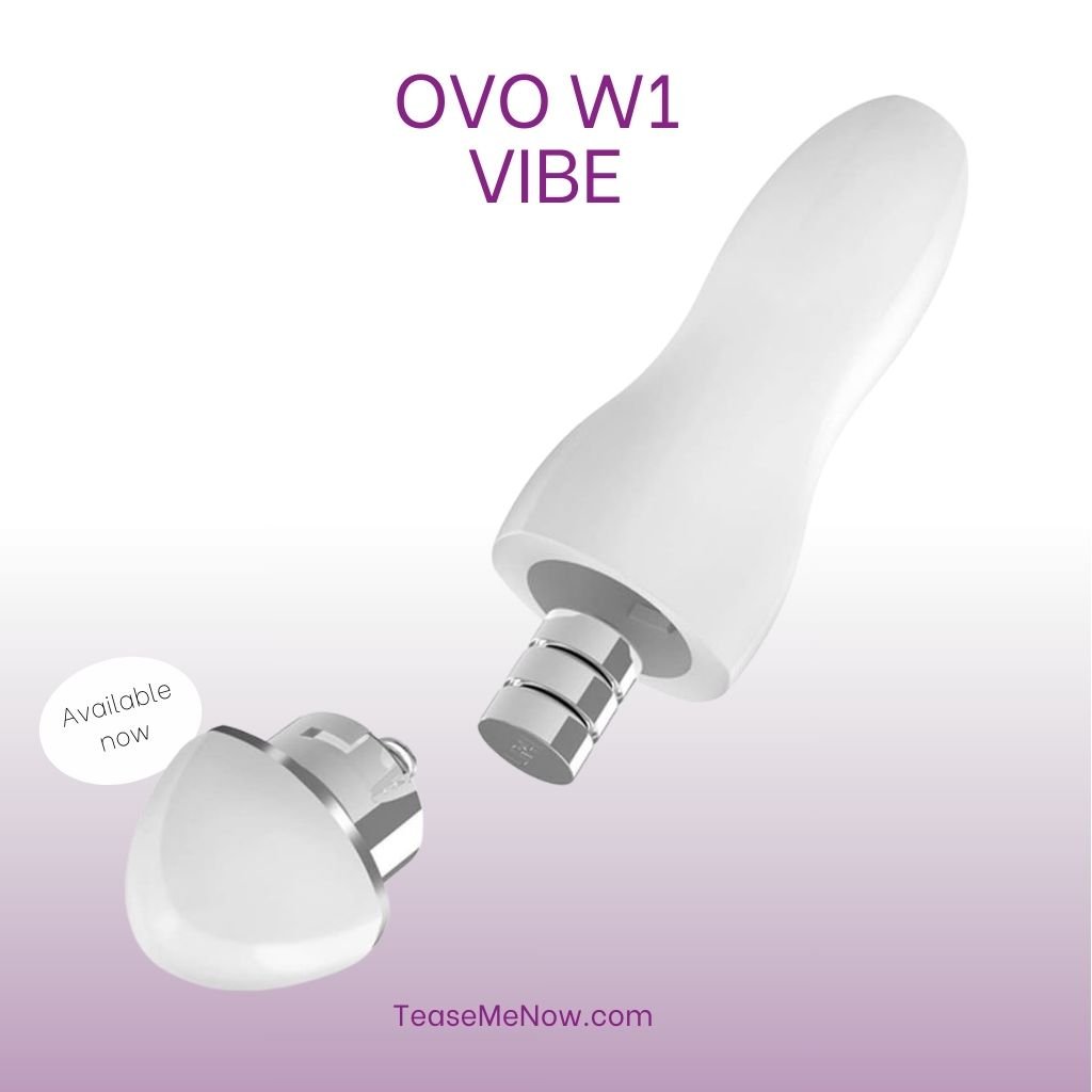 An advertisement featuring the 'OVO W1 Vibe.' The image shows a sleek, white vibrator with a detachable base, which is also displayed separately to highlight its components. The product name, 'OVO W1 Vibe,' is prominently displayed at the top in purple text. Below, a circular badge indicates that the product is 'Available now.' The background features a gradient from white to soft purple,